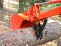 MT618 thumb on a Kubota BH90 backhoe log lifting 2